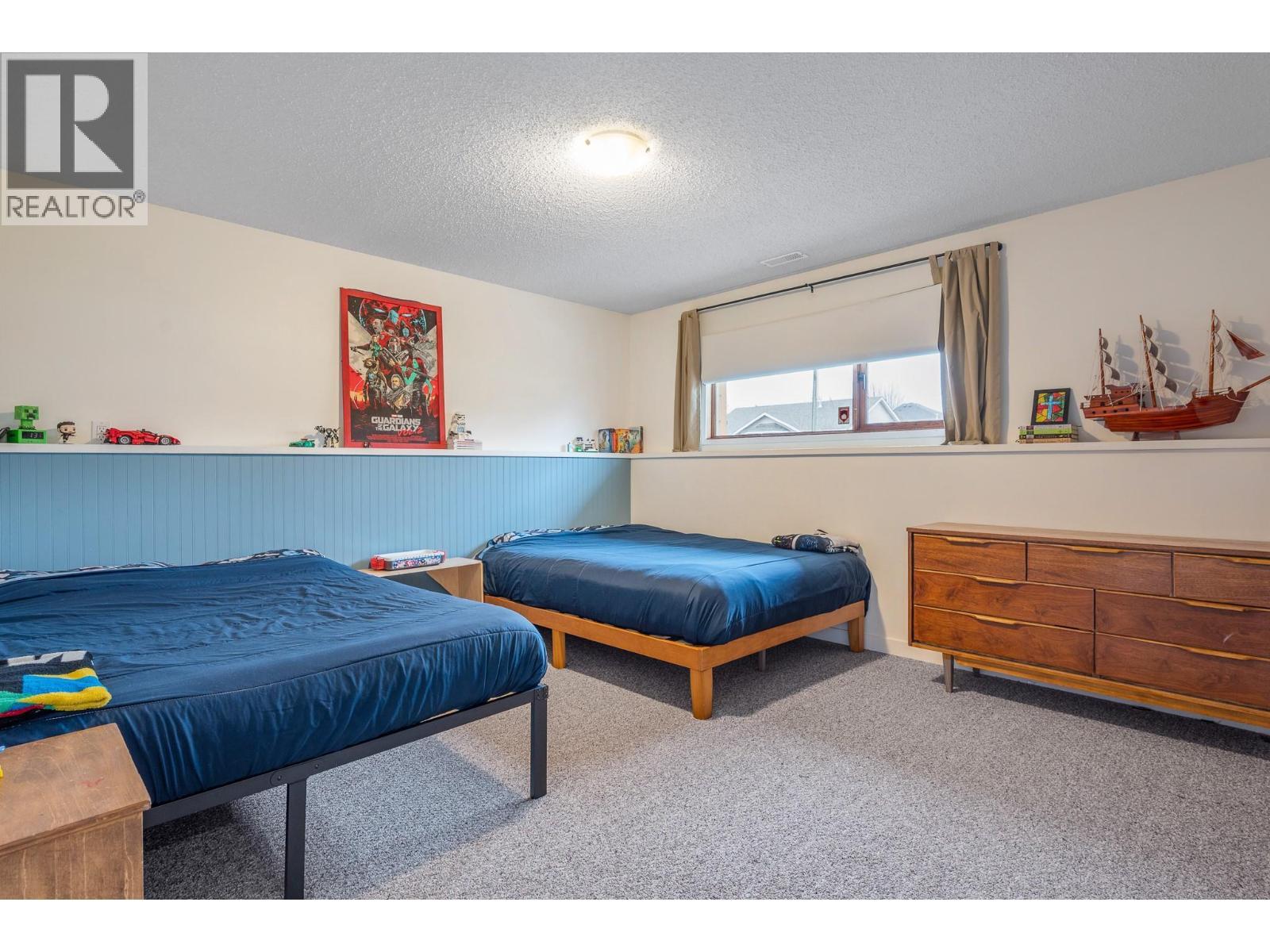 Main Home - Third Bedroom (Basement) - 302 Bass Avenue, Enderby, BC - Indoor Photo Showing Bedroom