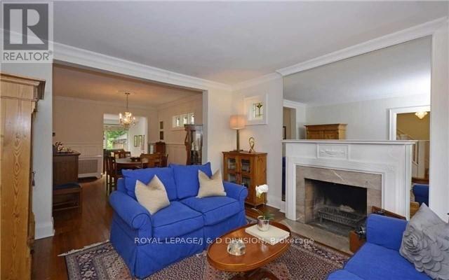 311 Chaplin Crescent, Toronto, ON - Indoor Photo Showing Living Room With Fireplace