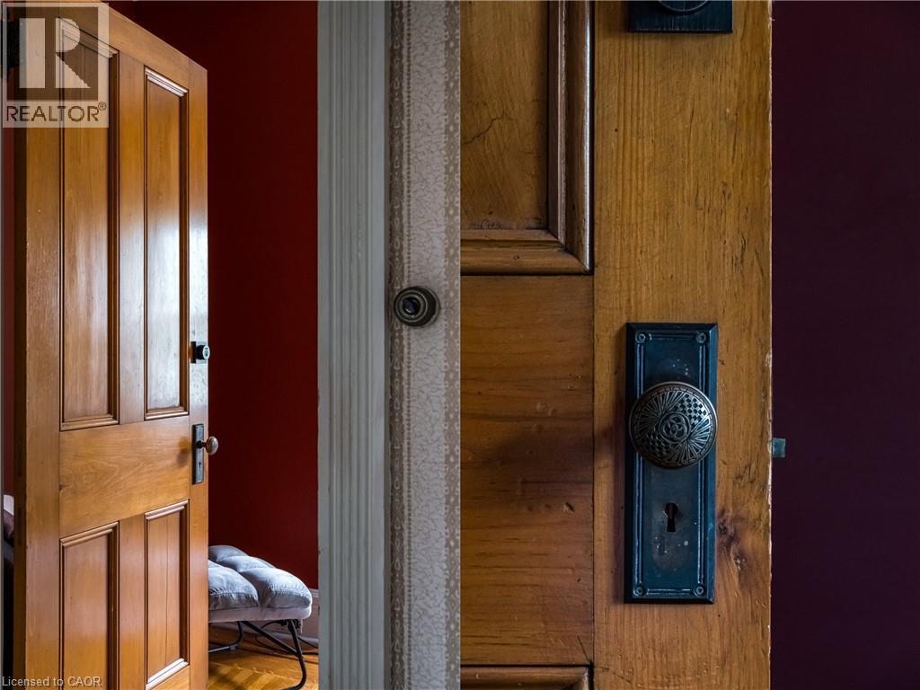 Hardwood paneled doors with decorative knob hardware - 95-97 S Fairholt Road S, Hamilton, ON - Indoor