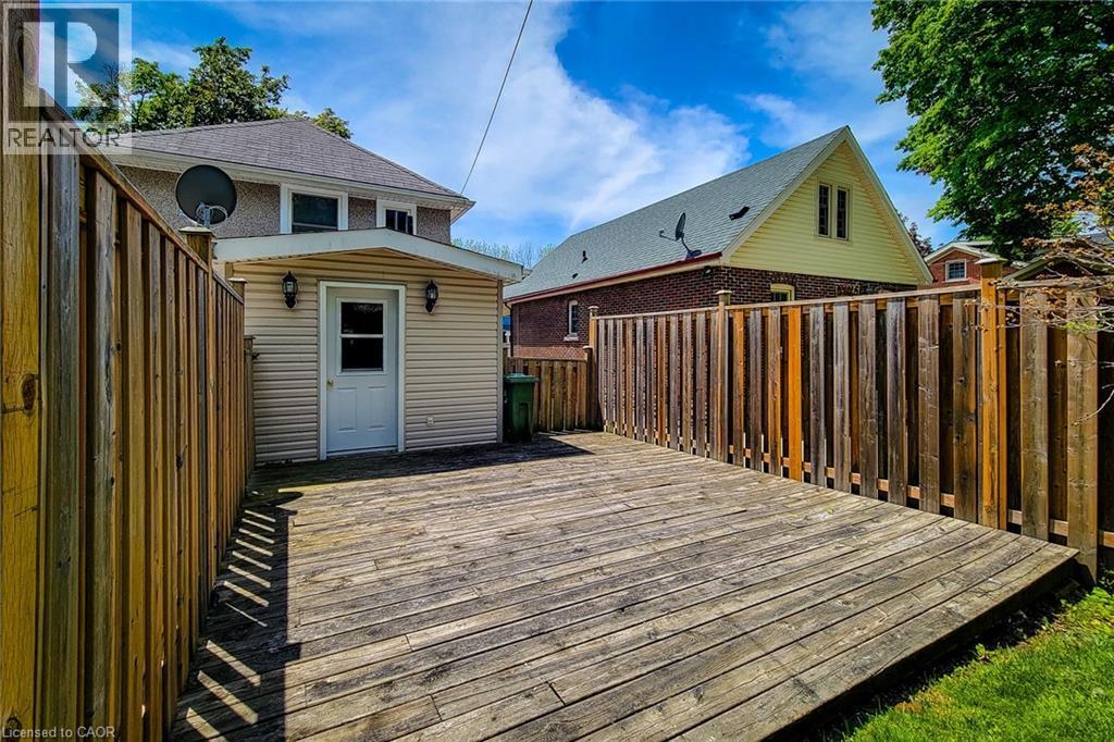 Spacious outdoor deck with privacy fencing - 319 King Street W, Dundas, ON - Outdoor With Exterior