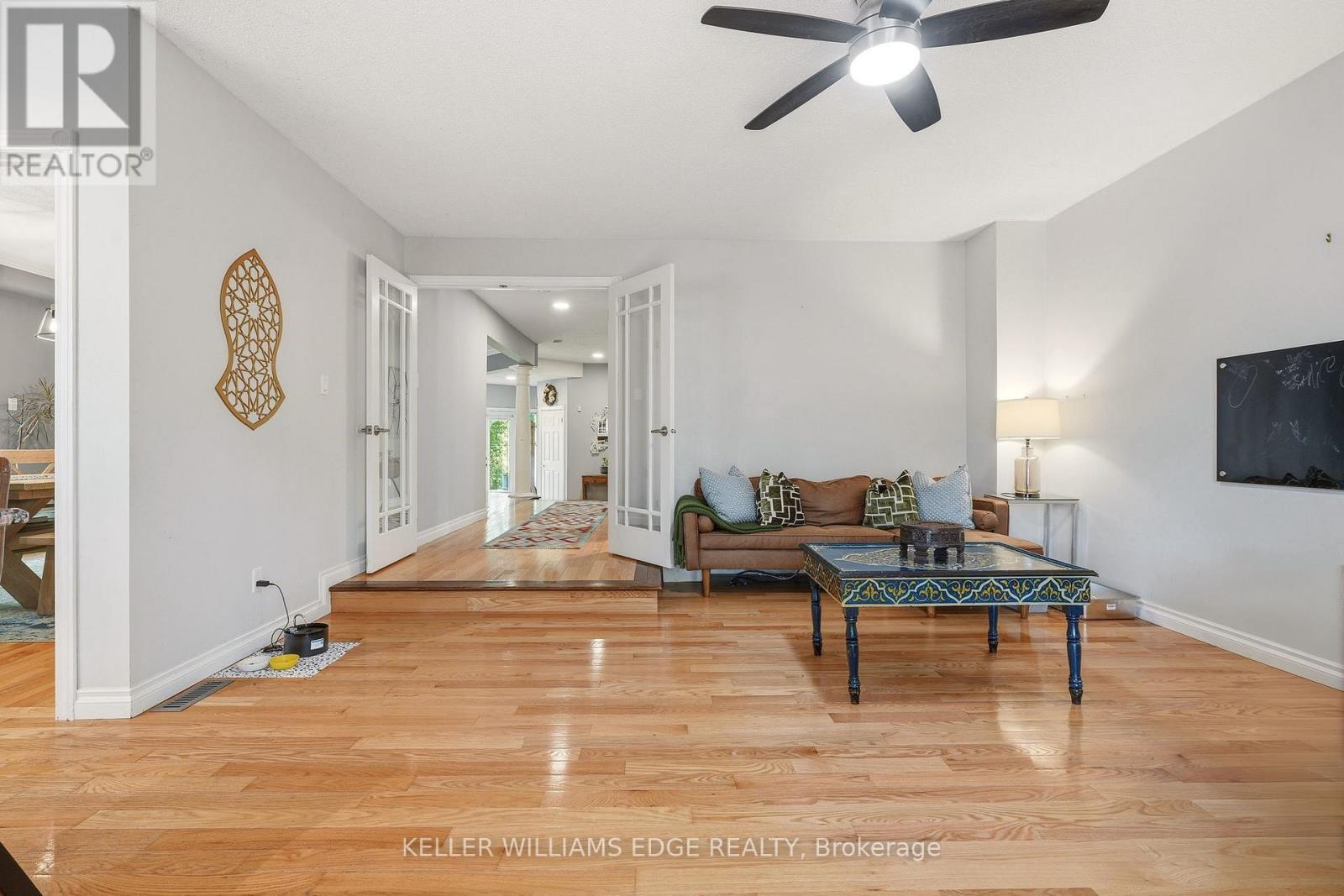 Bright family room w/ fireplace & deck/pool access - 149 Cove Crescent, Hamilton, ON - Indoor Photo Showing Other Room