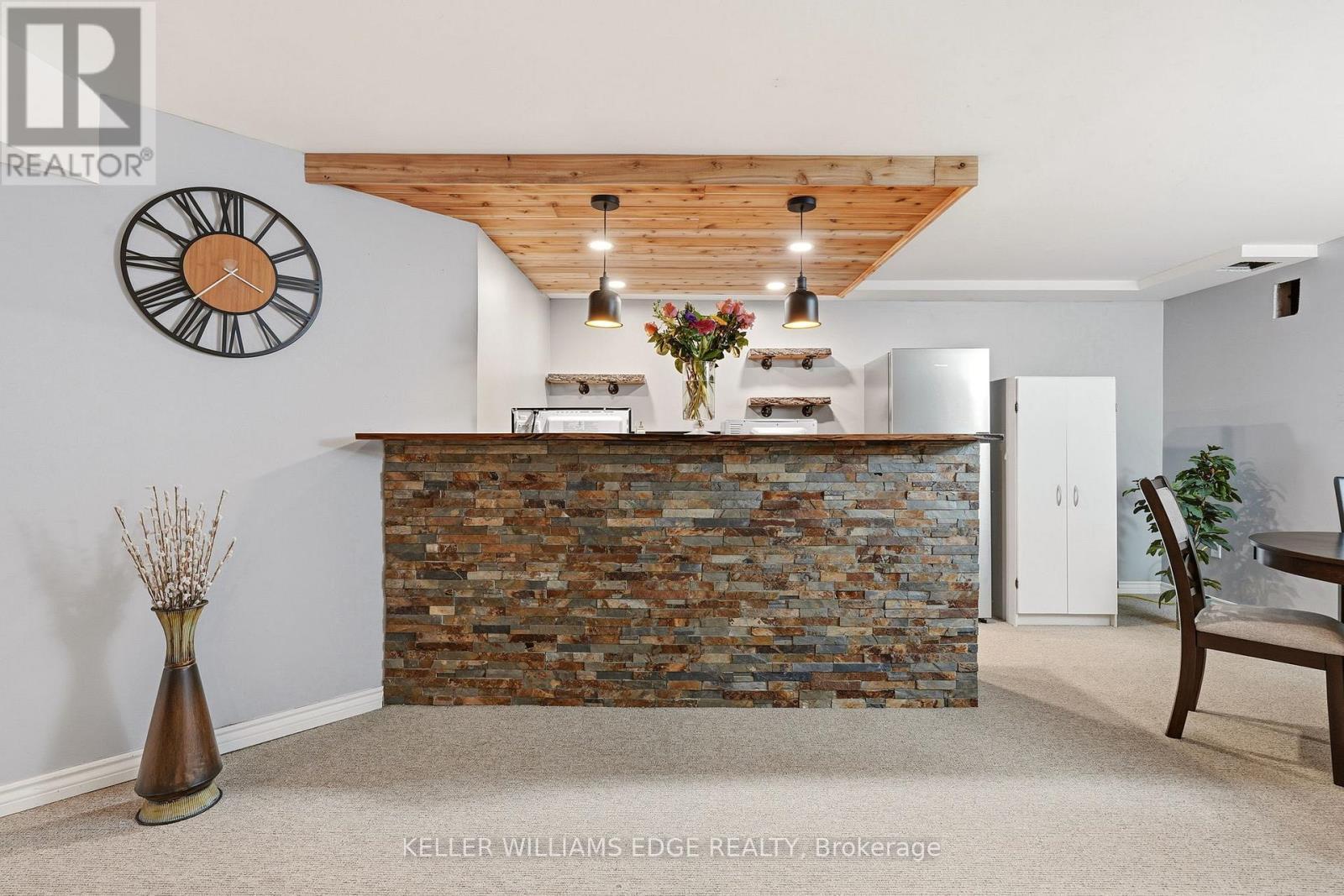 Basement rec room w/ wet bar & stone accent wall - 149 Cove Crescent, Hamilton, ON - Indoor Photo Showing Other Room