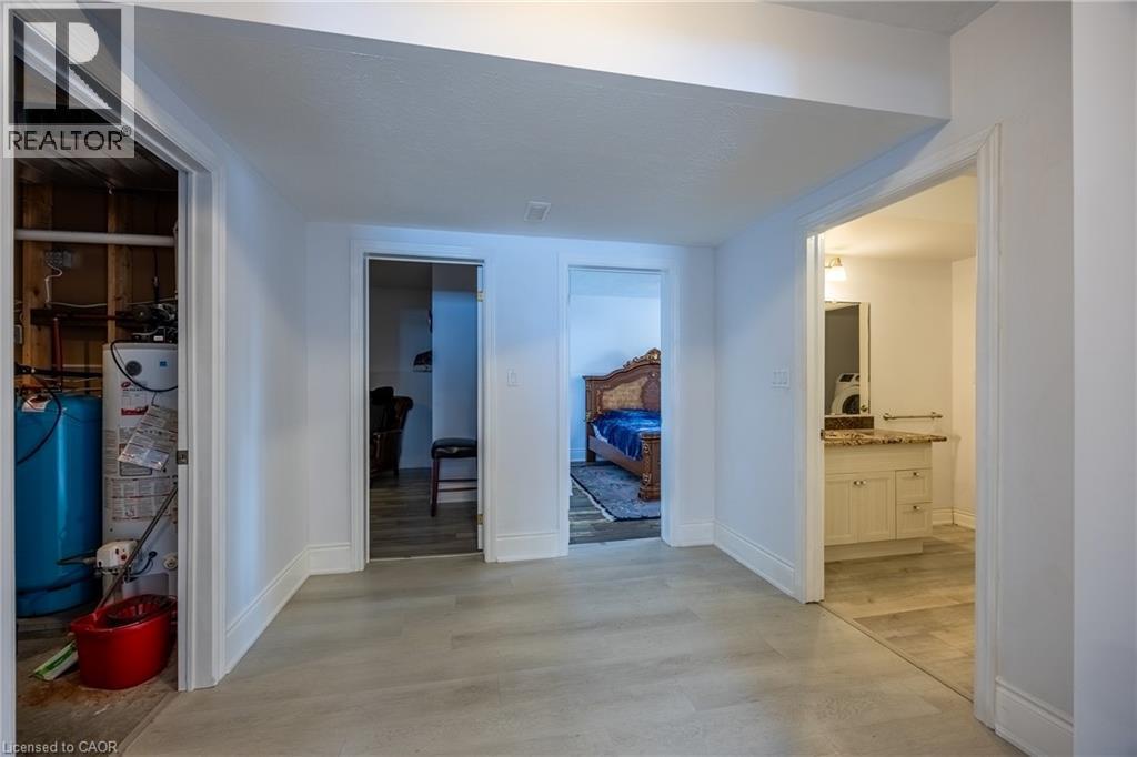 Interior hallway featuring light-colored wood-finish flooring - 514 Fishers Glen Road, Vittoria, ON - Indoor Photo Showing Other Room
