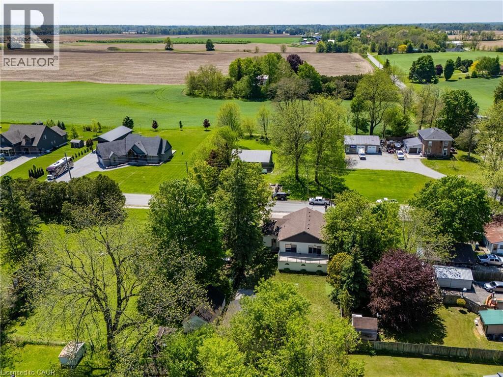 Rural setting featuring extensive green fields surrounding properties - 514 Fishers Glen Road, Vittoria, ON - Outdoor With View