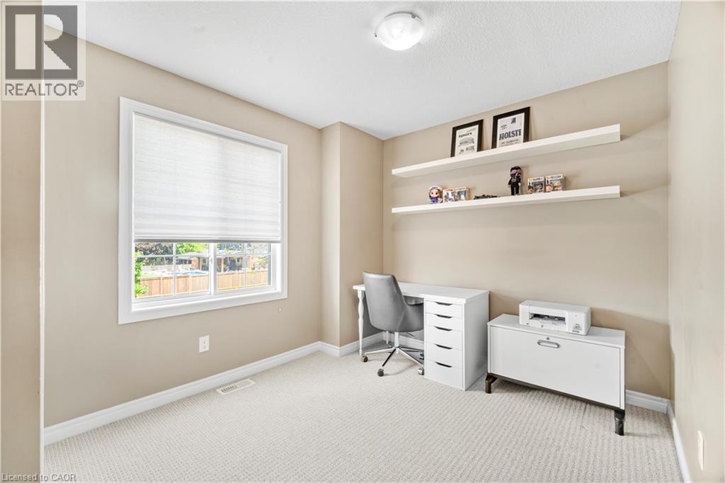 Room featuring light tan walls, white trim, and light-colored carpet - 21 Davinci Boulevard, Hamilton, ON - Indoor