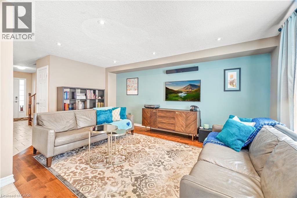 Living area featuring recessed lighting and wood-finish flooring - 21 Davinci Boulevard, Hamilton, ON - Indoor Photo Showing Living Room