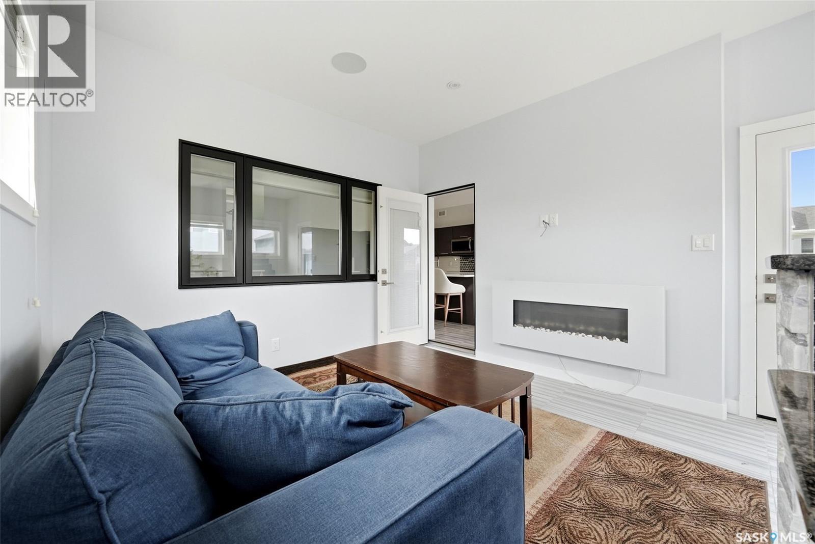 1609 Maple Hill Crescent N, Regina, SK - Indoor Photo Showing Living Room With Fireplace