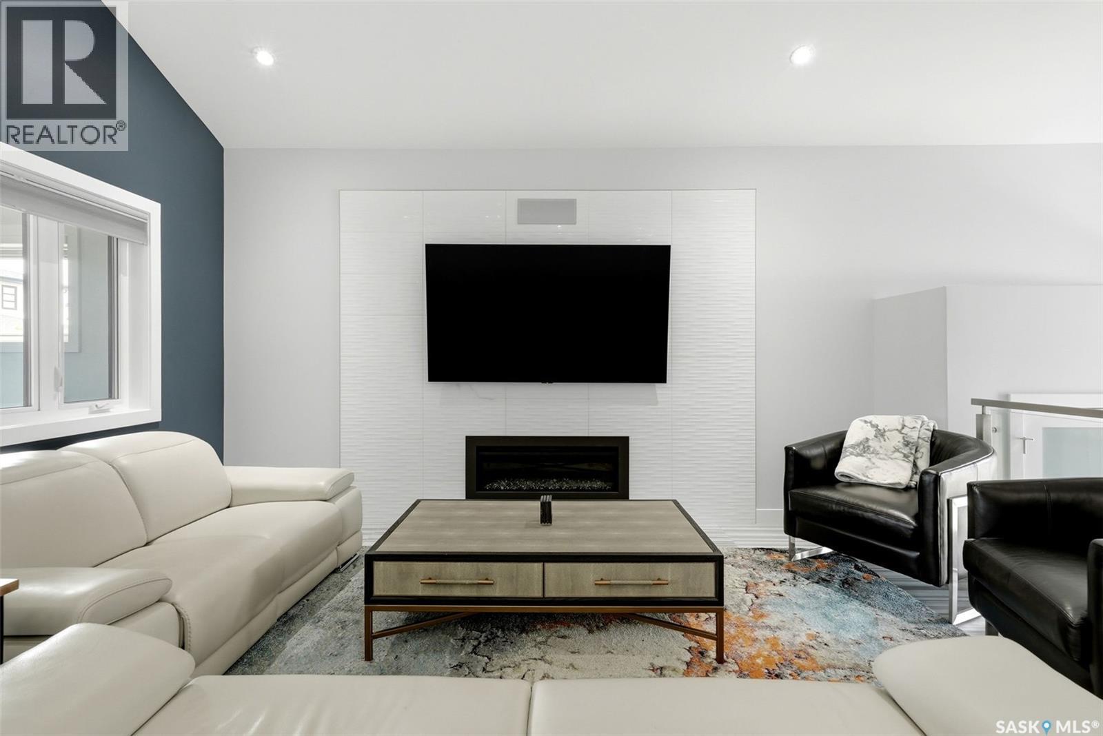 1609 Maple Hill Crescent N, Regina, SK - Indoor Photo Showing Living Room With Fireplace
