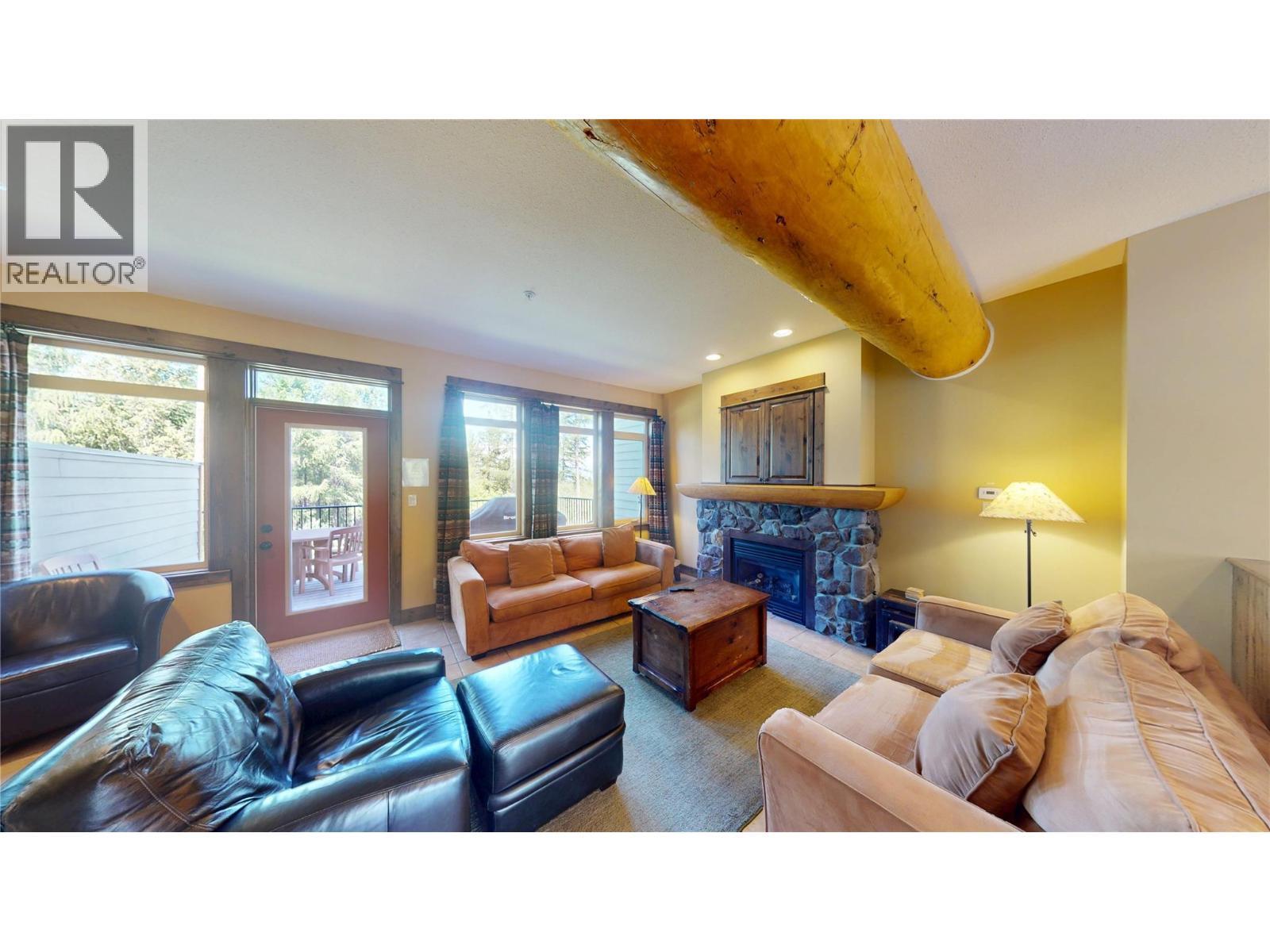 1351 Gerry Sorensen Way Unit# J2-B, Kimberley, BC - Indoor Photo Showing Living Room With Fireplace