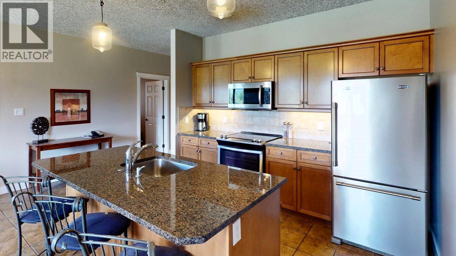 400 Bighorn Boulevard Unit# 416 K1, Radium Hot Springs, BC - Indoor Photo Showing Kitchen With Stainless Steel Kitchen With Double Sink
