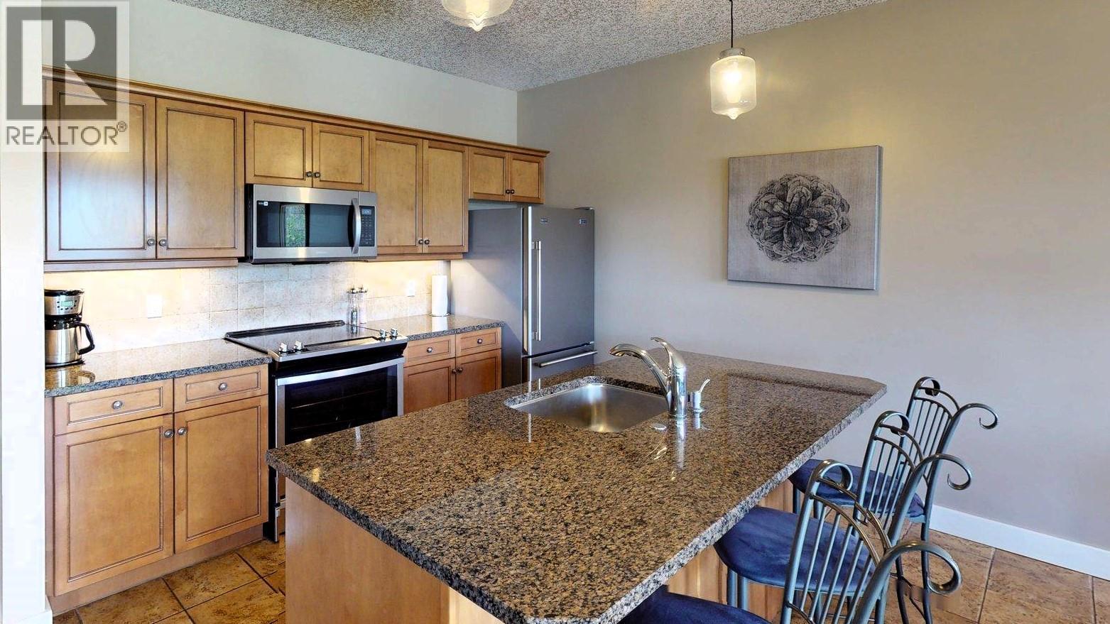 400 Bighorn Boulevard Unit# 416 K1, Radium Hot Springs, BC - Indoor Photo Showing Kitchen With Stainless Steel Kitchen