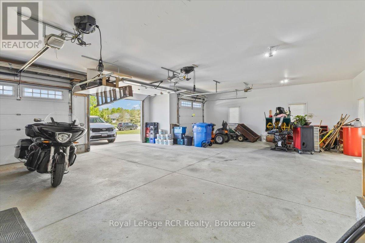 Triple Car Garage with Stairs to Basement - 108 Marshall Heights Road, West Grey, ON - Indoor Photo Showing Garage