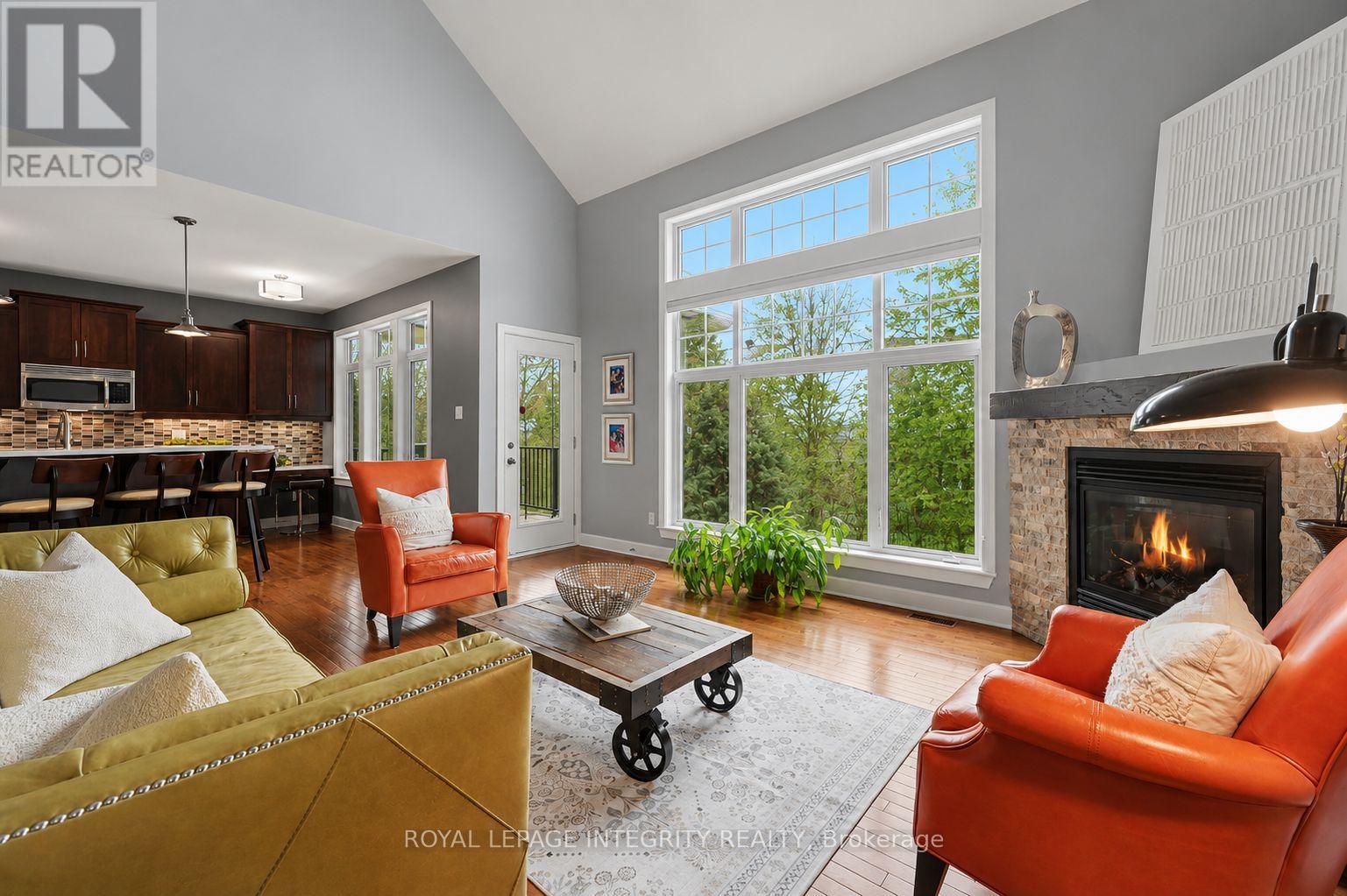 15 Marsh Sparrow Private, Ottawa, ON - Indoor Photo Showing Living Room With Fireplace