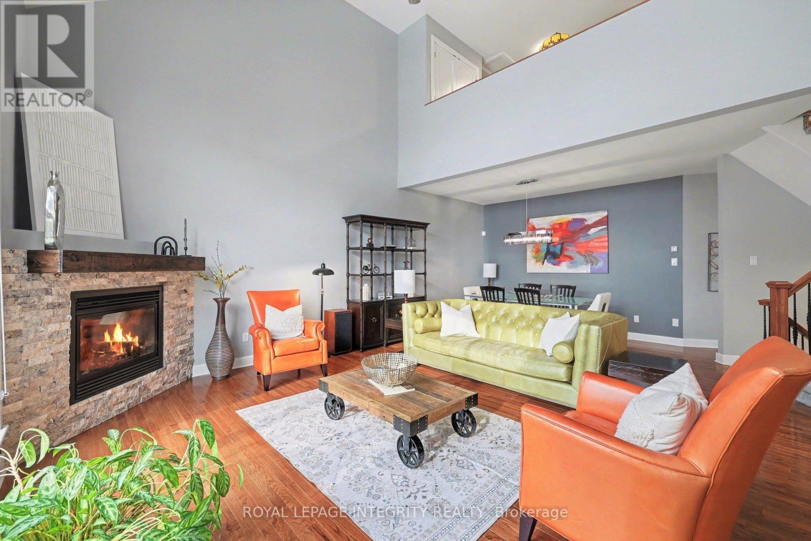 15 Marsh Sparrow Private, Ottawa, ON - Indoor Photo Showing Living Room With Fireplace