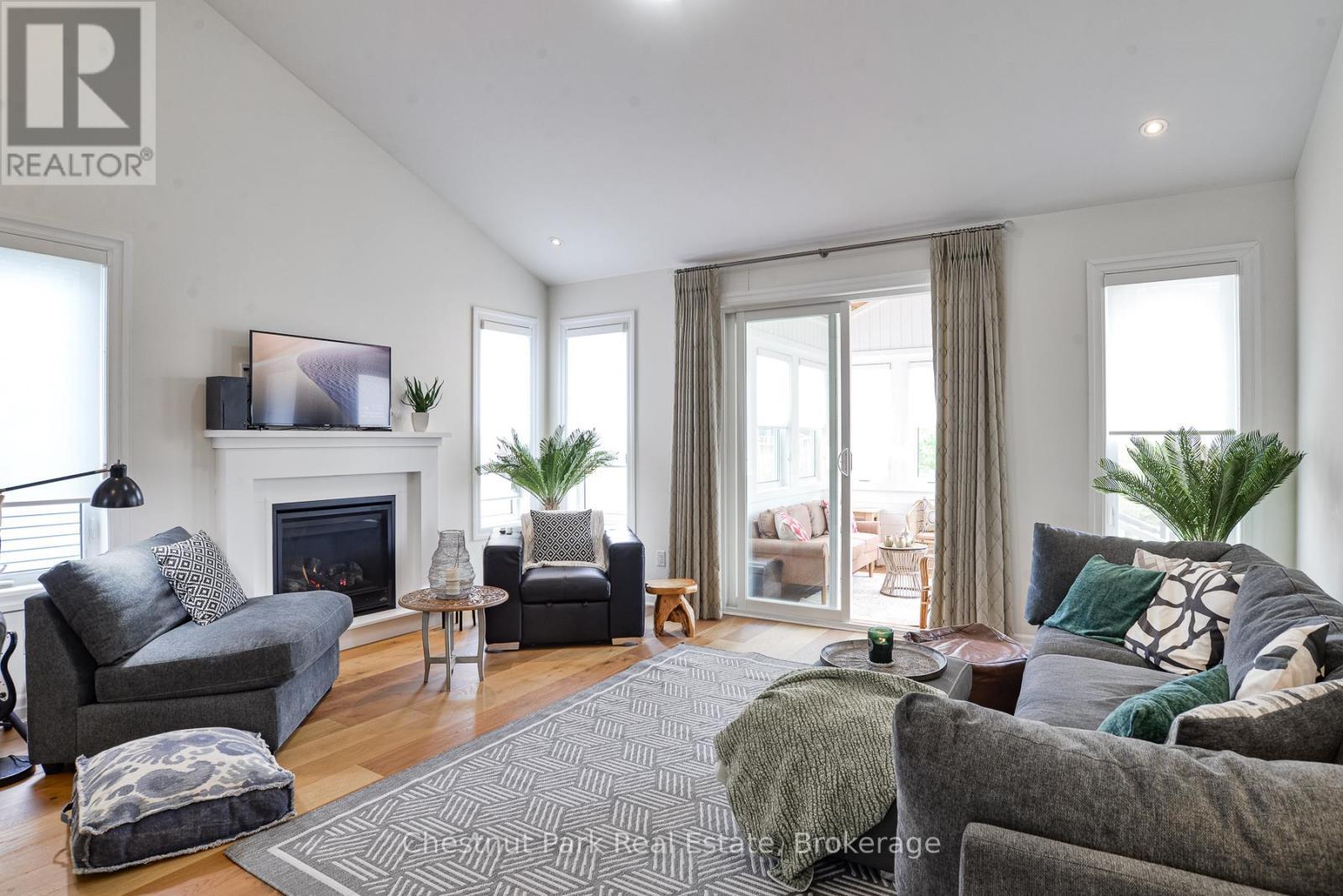 custom blinds throughout - 5 Hunter Place, Bracebridge (Macaulay), ON - Indoor Photo Showing Living Room With Fireplace