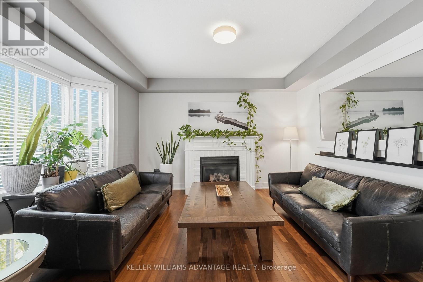 4 Cranberry Lane, Barrie, ON - Indoor Photo Showing Living Room With Fireplace