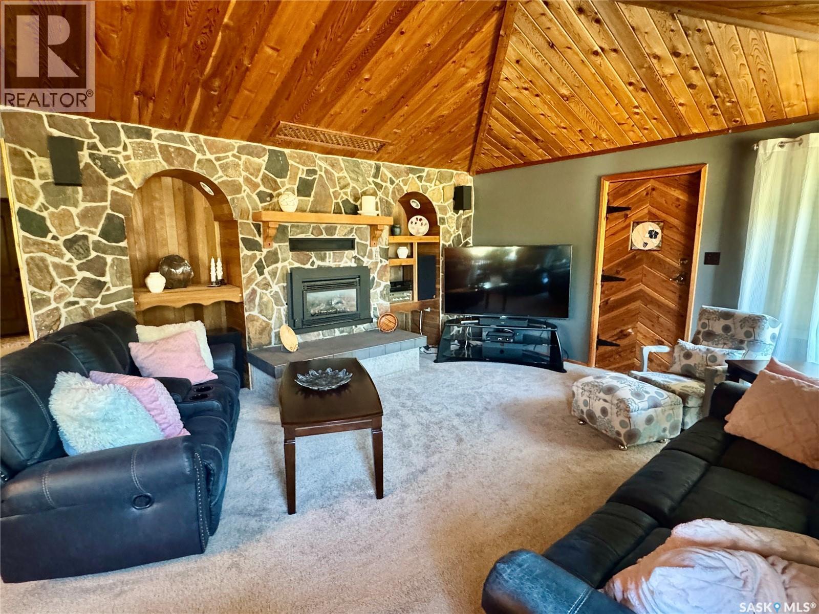 1632 Studer Street, La Ronge, SK - Indoor Photo Showing Living Room With Fireplace