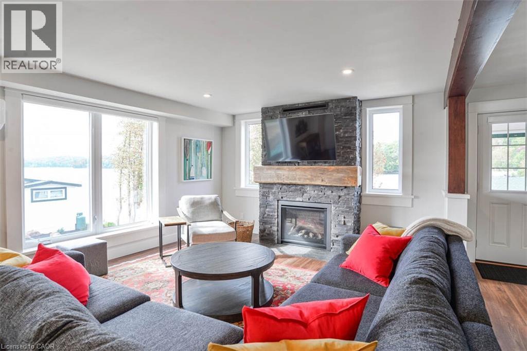 1021 Marina Road, Huntsville, ON - Indoor Photo Showing Living Room With Fireplace