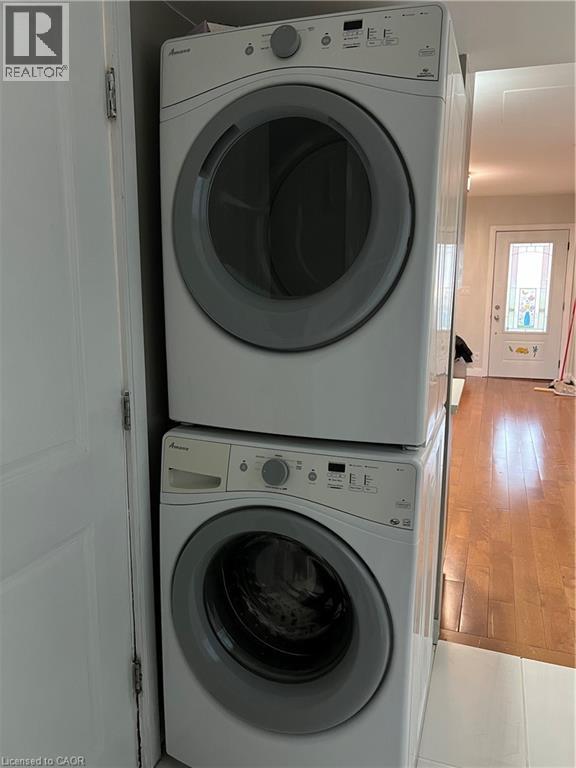 Stackable washer and dryer unit, featuring front-loading doors and integrated control panels - 179 S Vine Street S, St. Catharines, ON