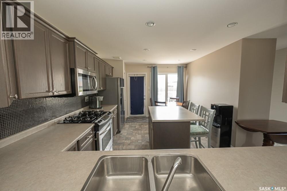363 Levalley Cove, Saskatoon, SK - Indoor Photo Showing Kitchen With Stainless Steel Kitchen With Double Sink