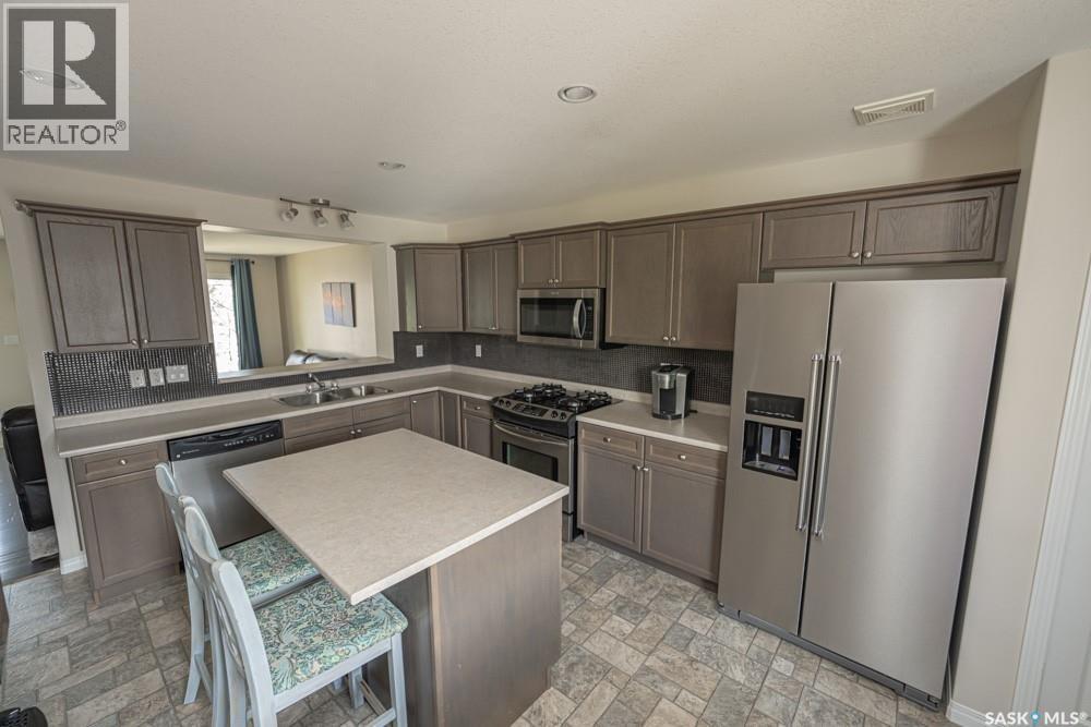 363 Levalley Cove, Saskatoon, SK - Indoor Photo Showing Kitchen With Stainless Steel Kitchen With Double Sink