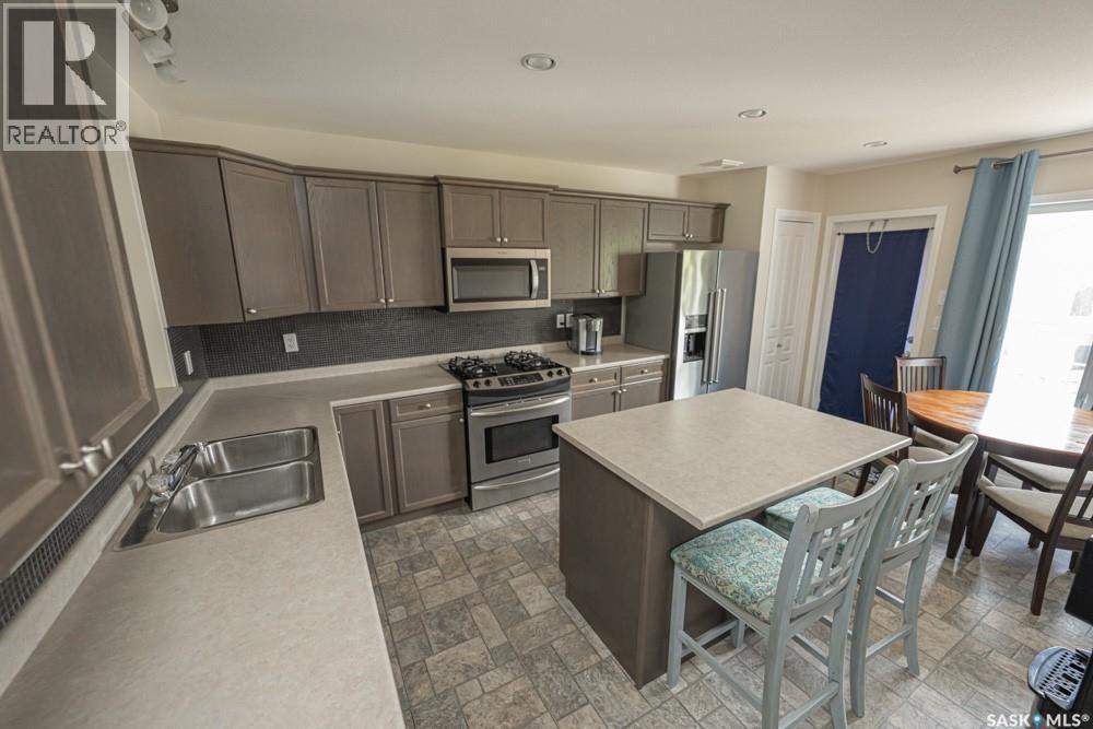 363 Levalley Cove, Saskatoon, SK - Indoor Photo Showing Kitchen With Stainless Steel Kitchen With Double Sink