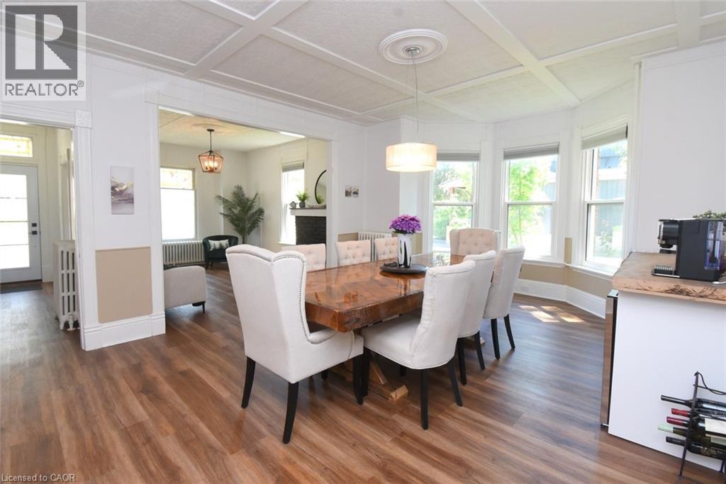 Dining area featuring coffered ceilings and a bay window - 89 Lynden Road, Lynden, ON