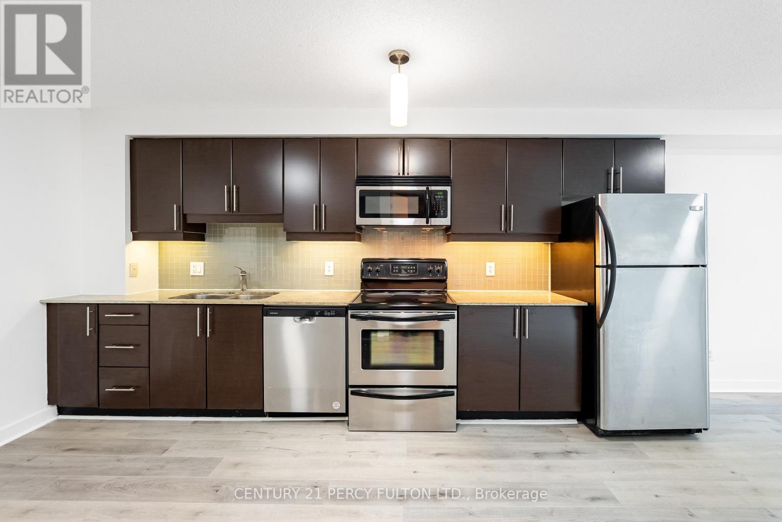 703 - 18 Harbour Street, Toronto, ON - Indoor Photo Showing Kitchen With Double Sink