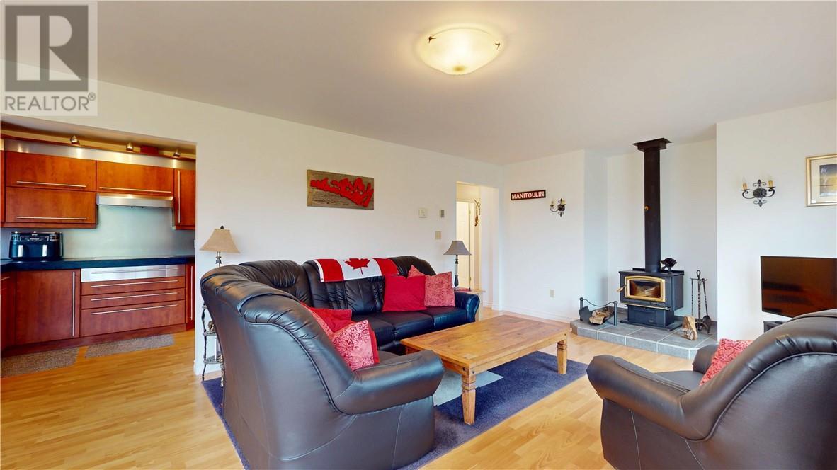 12 Islandview, Mindemoya, ON - Indoor Photo Showing Living Room With Fireplace