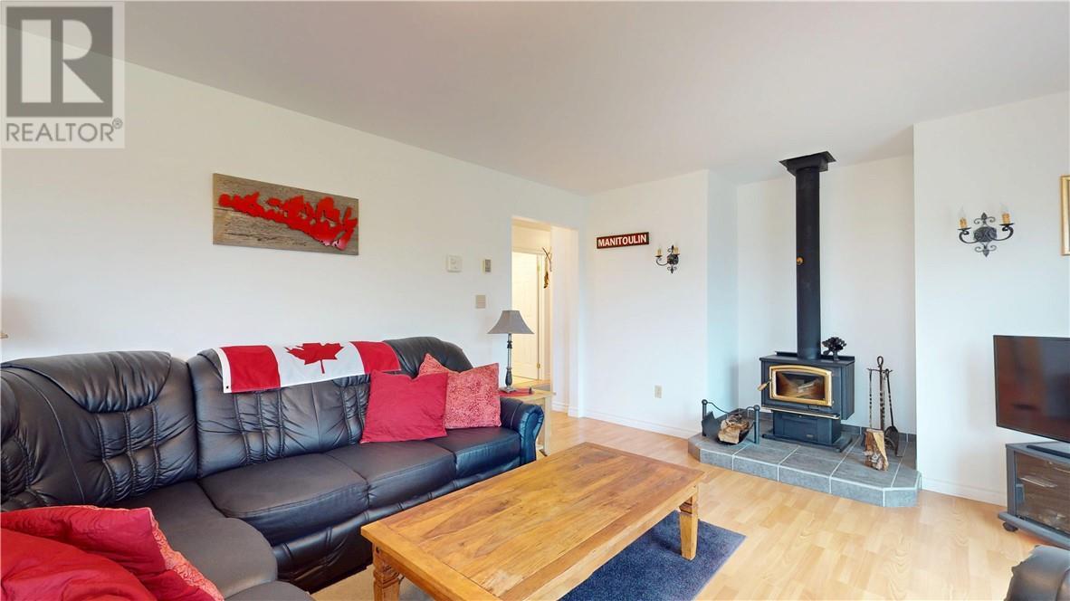 12 Islandview, Mindemoya, ON - Indoor Photo Showing Living Room With Fireplace
