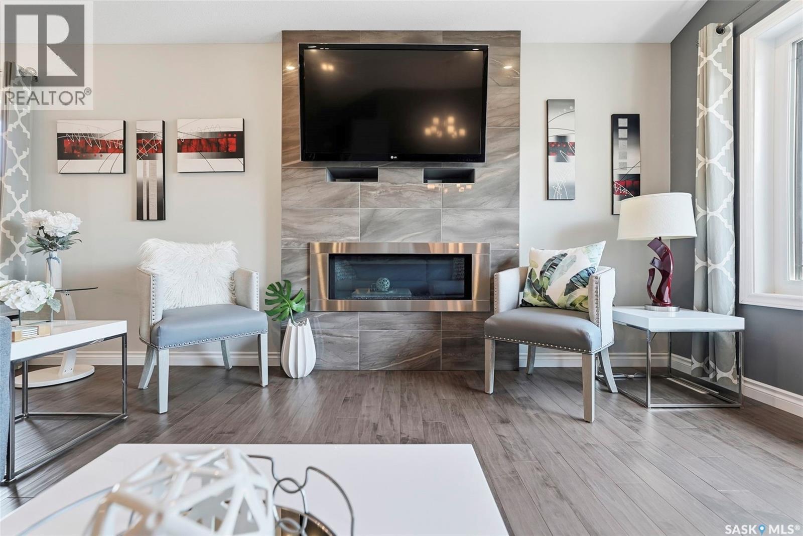 711 Sutter Crescent, Saskatoon, SK - Indoor Photo Showing Living Room With Fireplace