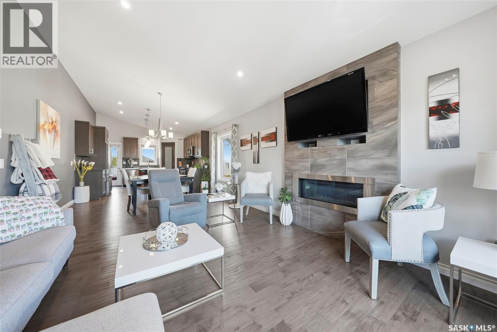 711 Sutter Crescent, Saskatoon, SK - Indoor Photo Showing Living Room With Fireplace