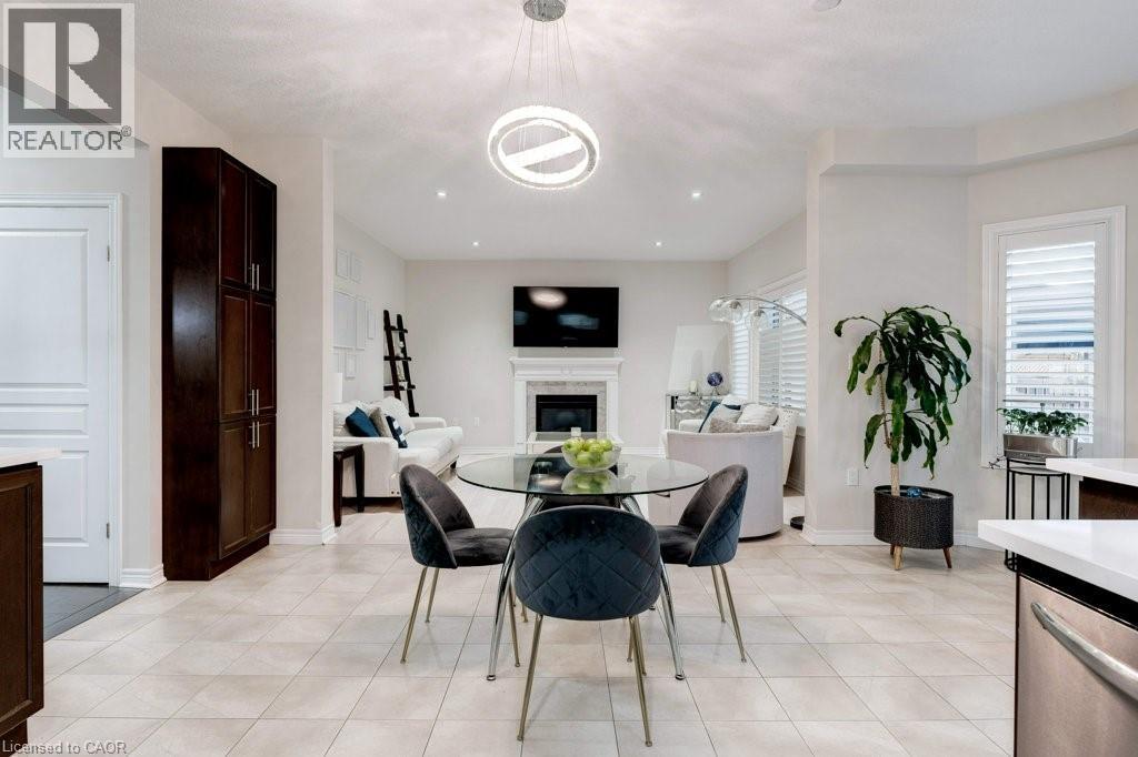 85 Showcase Drive, Hamilton, ON - Indoor Photo Showing Dining Room With Fireplace