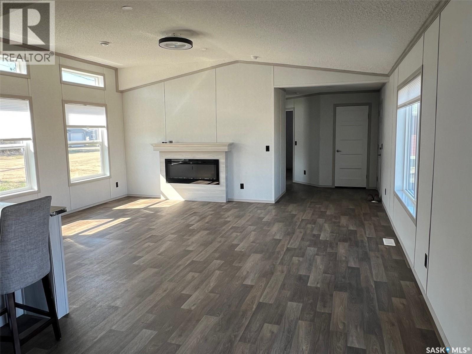 215 1St Street W, Meota, SK - Indoor Photo Showing Other Room With Fireplace