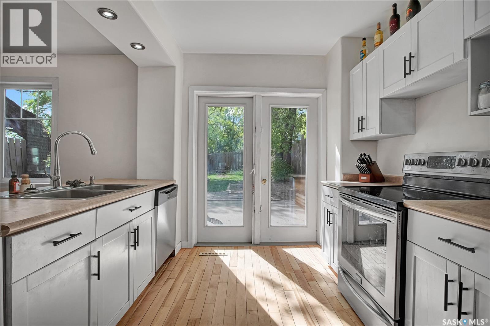 213 H Avenue N, Saskatoon, SK - Indoor Photo Showing Kitchen With Double Sink