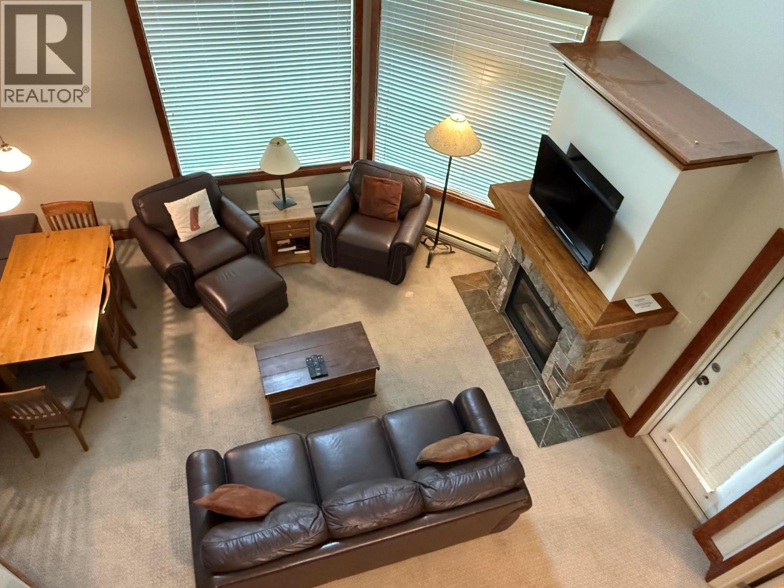 4559 Timberline Crescent Unit# 545A, Fernie, BC - Indoor Photo Showing Living Room With Fireplace