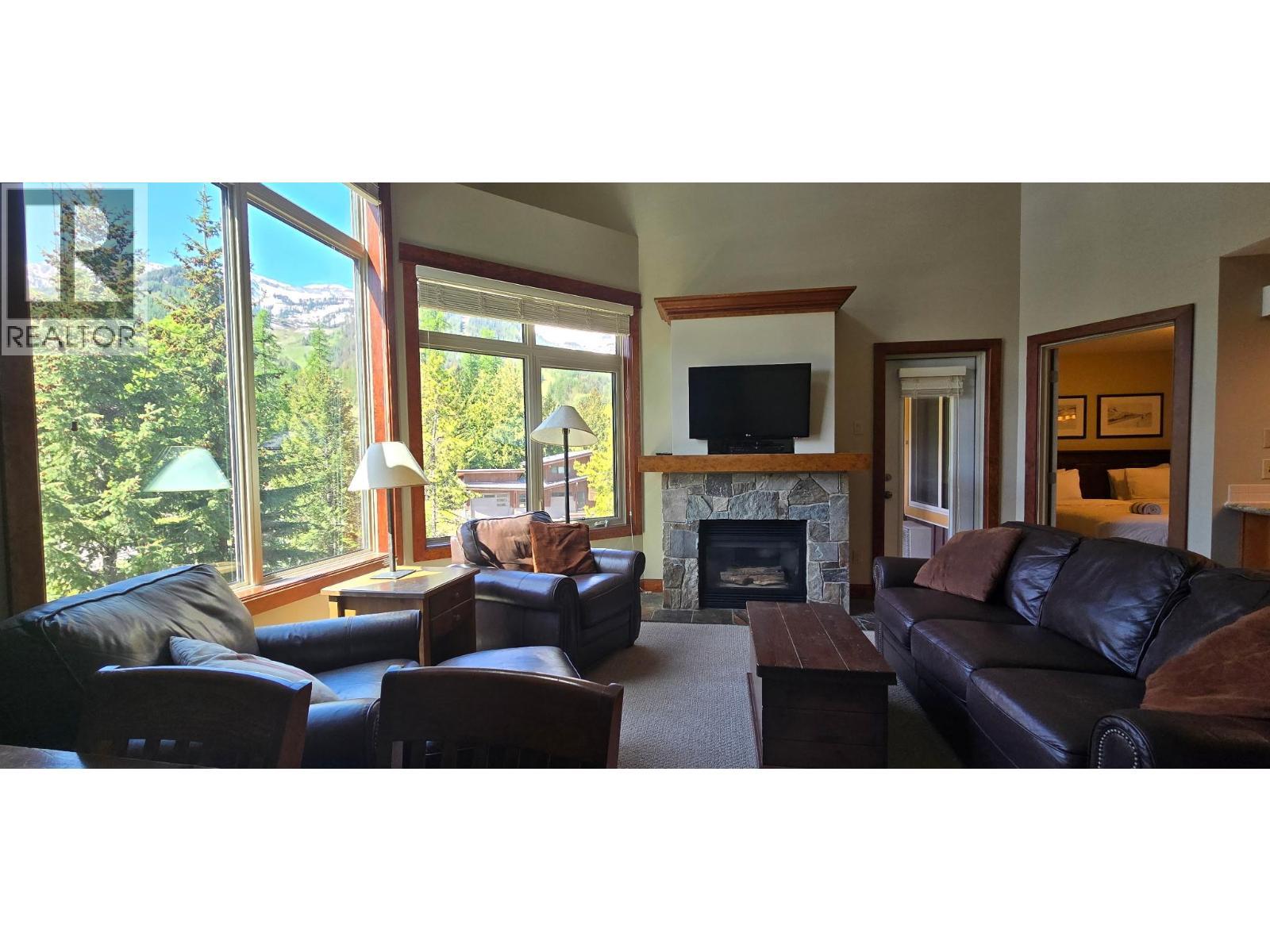 4559 Timberline Crescent Unit# 545A, Fernie, BC - Indoor Photo Showing Living Room With Fireplace