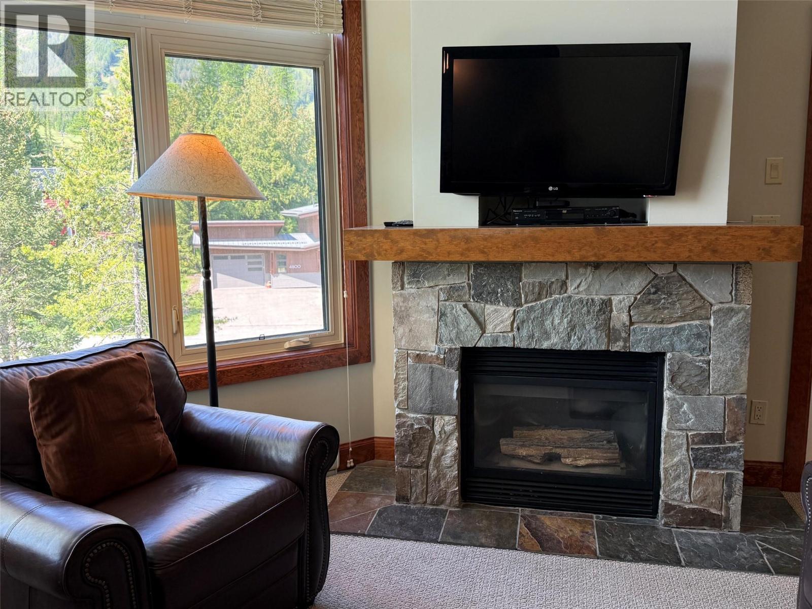 4559 Timberline Crescent Unit# 545A, Fernie, BC - Indoor Photo Showing Living Room With Fireplace