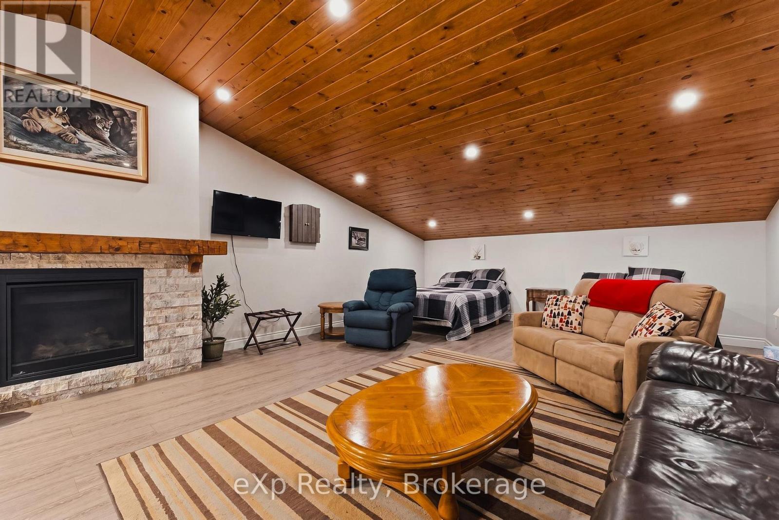 Apartment in Workshop - 100 Harris Crescent, Southgate, ON - Indoor Photo Showing Living Room With Fireplace