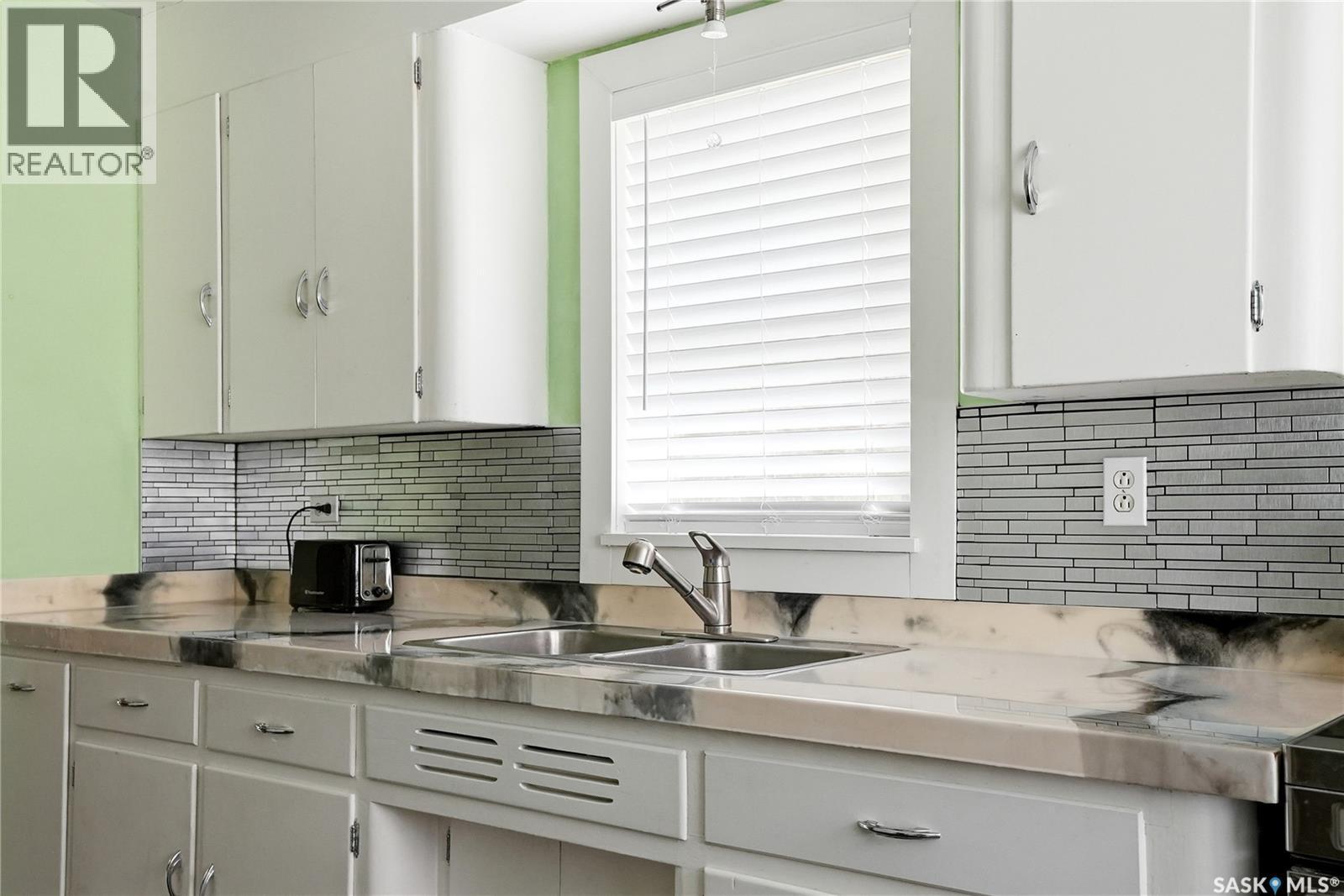 340 Charles Street, Asquith, SK - Indoor Photo Showing Kitchen With Double Sink