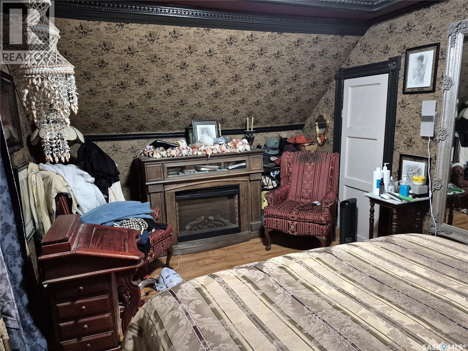303 Edward Street, Radisson, SK - Indoor Photo Showing Bedroom With Fireplace