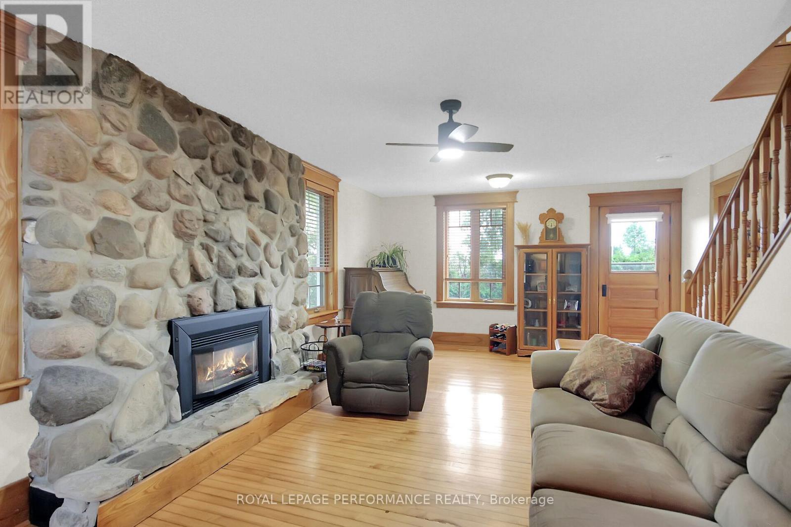 9374 Marvelville Road, Ottawa, ON - Indoor Photo Showing Living Room With Fireplace
