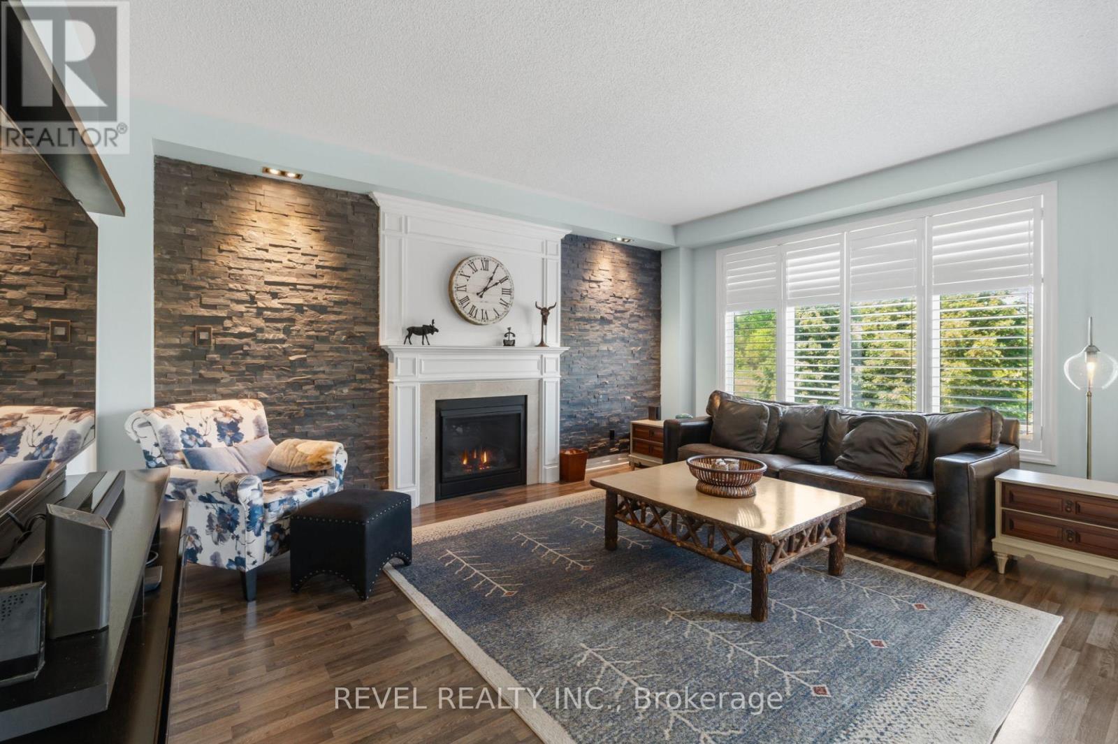 74 Mount Crescent, Essa, ON - Indoor Photo Showing Living Room With Fireplace