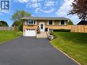 Split-level residence featuring a brick facade, attached garage, and asphalt driveway - 107 Rosslinn Road, Cambridge, ON  - Outdoor With Facade 