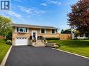 Split-level residence featuring a brick facade with stone accents - 107 Rosslinn Road, Cambridge, ON  - Outdoor With Facade 