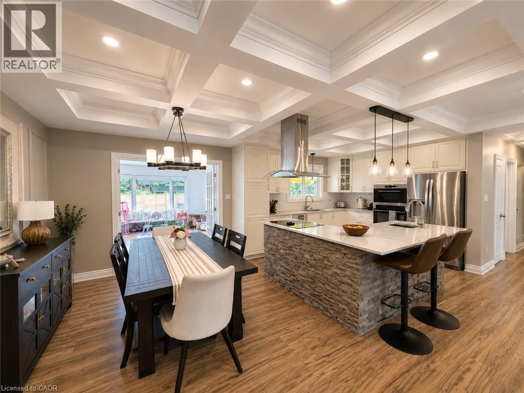 Open-concept kitchen and dining area featuring coffered ceilings with recessed lighting - 107 Rosslinn Road, Cambridge, ON - Indoor
