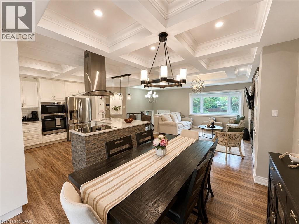 Open-concept living space with coffered ceilings, wood-finish flooring, and recessed lighting - 107 Rosslinn Road, Cambridge, ON - Indoor