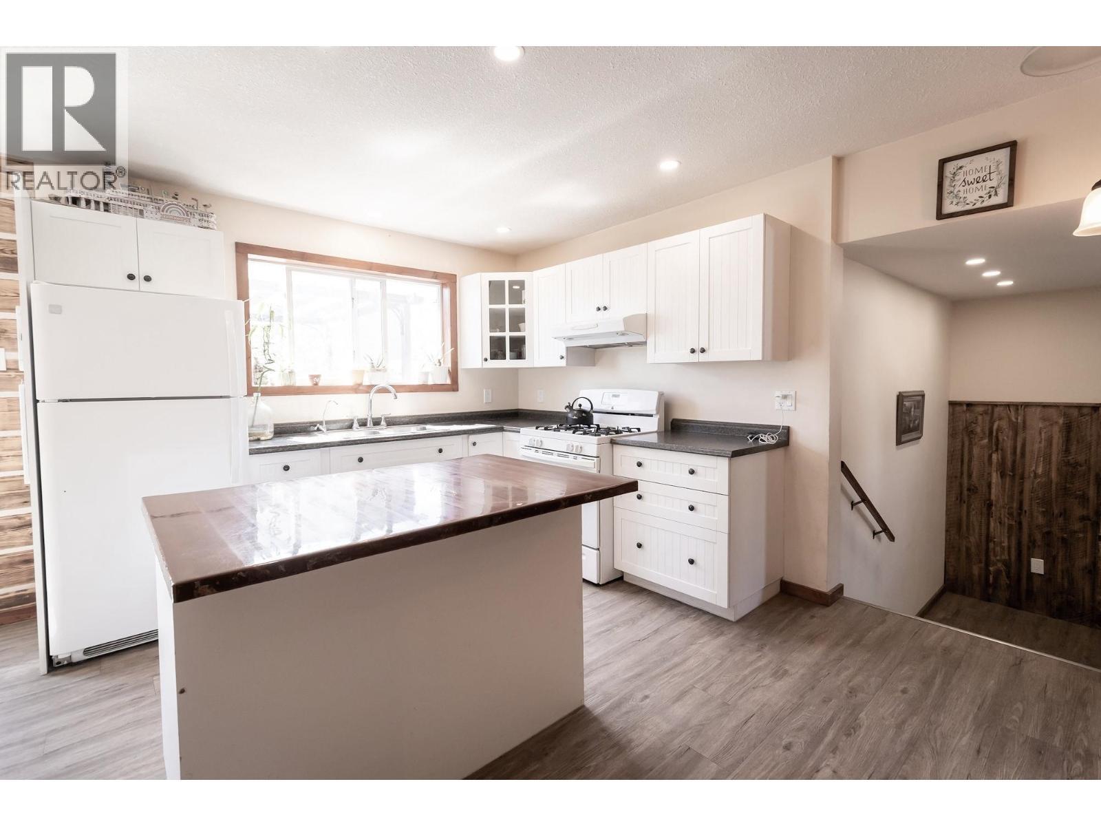 1016 240 Road, Fort St. John, BC - Indoor Photo Showing Kitchen With Double Sink