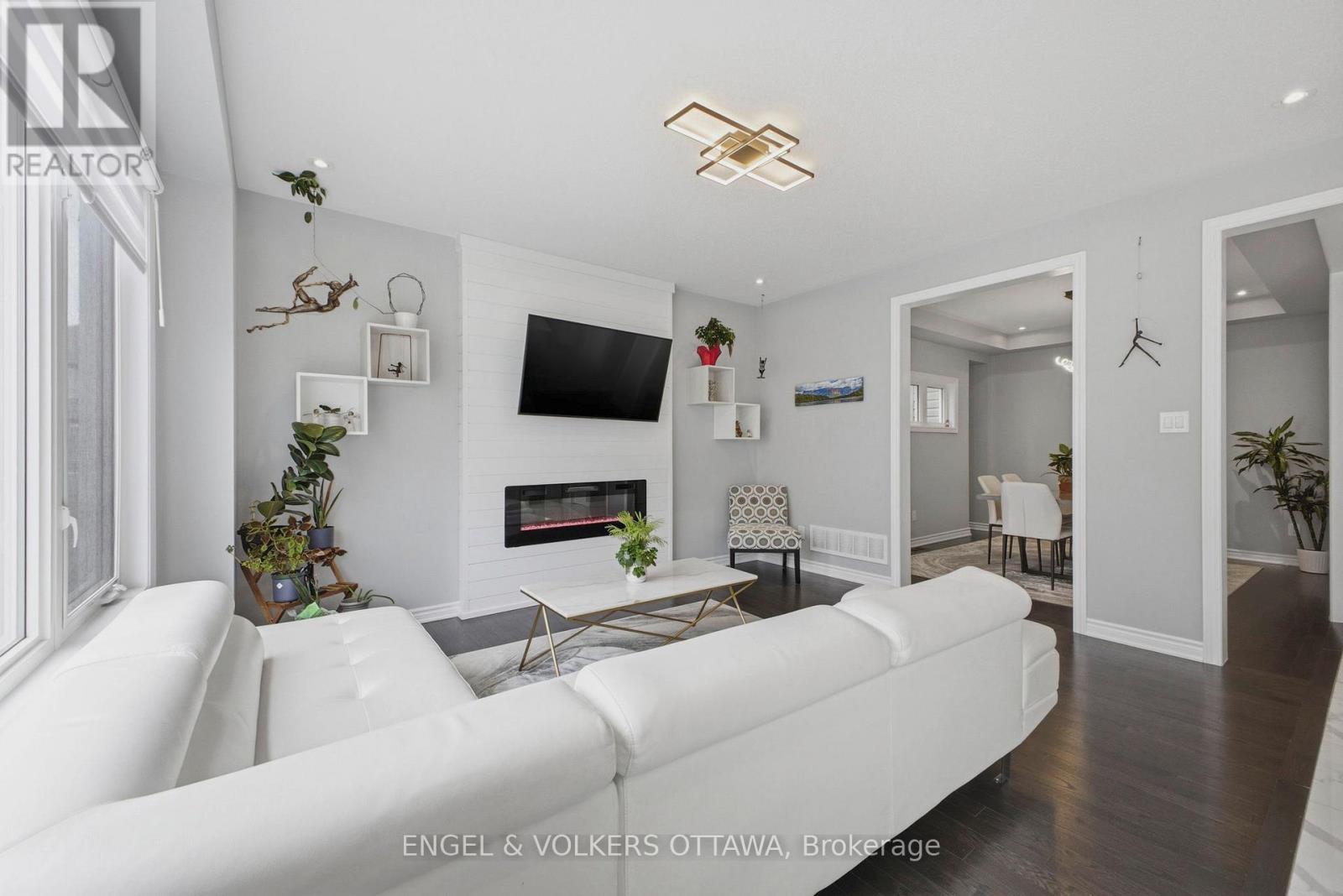 139 Switch Grass Crescent, Ottawa, ON - Indoor Photo Showing Living Room With Fireplace