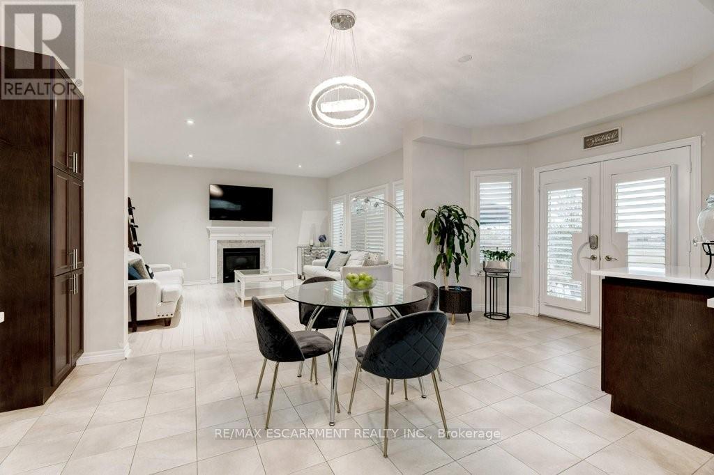 85 Showcase Drive, Hamilton, ON - Indoor Photo Showing Dining Room With Fireplace